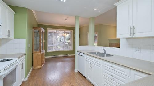 108-1962 Enterprise Way, Kelowna, BC - Indoor Photo Showing Kitchen With Double Sink