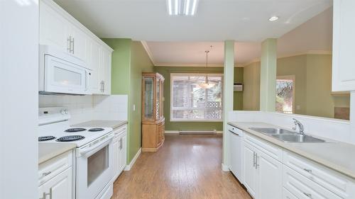 108-1962 Enterprise Way, Kelowna, BC - Indoor Photo Showing Kitchen With Double Sink