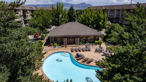 108-1962 Enterprise Way, Kelowna, BC - Outdoor With In Ground Pool With Deck Patio Veranda