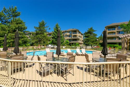 108-1962 Enterprise Way, Kelowna, BC - Outdoor With In Ground Pool With Deck Patio Veranda