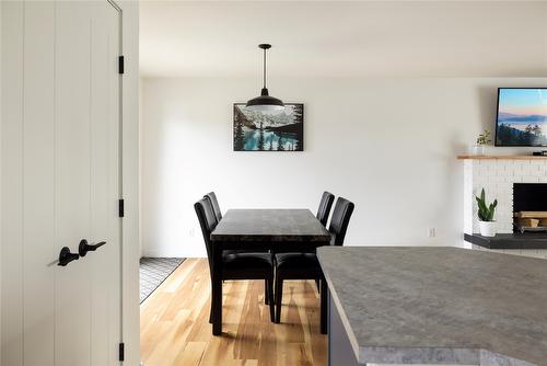 1203 39 Avenue, Vernon, BC - Indoor Photo Showing Dining Room With Fireplace