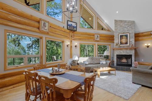 13575 Mountain Shores Road, Boswell, BC - Indoor Photo Showing Dining Room With Fireplace