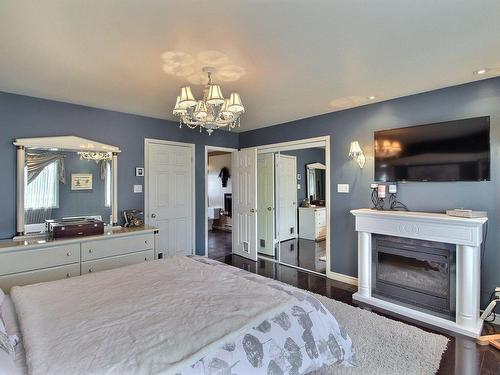 Master bedroom - 499  - 501 8E Avenue, Val-D'Or, QC - Indoor Photo Showing Bedroom With Fireplace