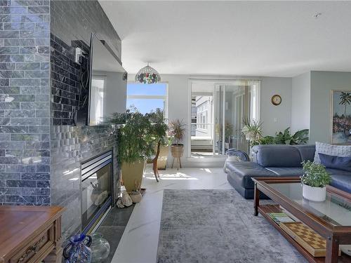 408-5110 Cordova Bay Rd, Saanich, BC - Indoor Photo Showing Living Room With Fireplace