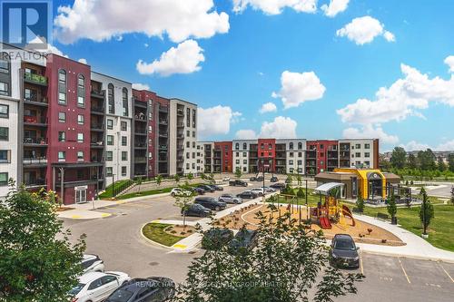 207 - 6 Spice Way, Barrie, ON - Outdoor With Balcony With Facade