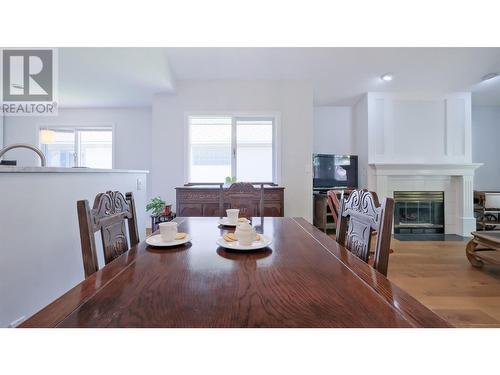 950 Lanfranco Road Unit# 45, Kelowna, BC - Indoor Photo Showing Dining Room With Fireplace