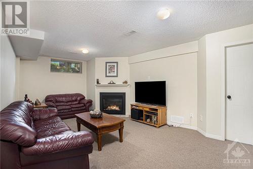 63 Chantilly Gate, Ottawa, ON - Indoor Photo Showing Living Room With Fireplace