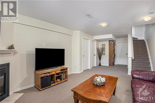 63 Chantilly Gate, Ottawa, ON - Indoor Photo Showing Living Room With Fireplace