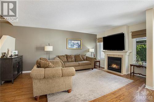 63 Chantilly Gate, Ottawa, ON - Indoor Photo Showing Living Room With Fireplace