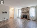 2843 Kutarna Crescent E, Regina, SK  - Indoor Photo Showing Living Room With Fireplace 