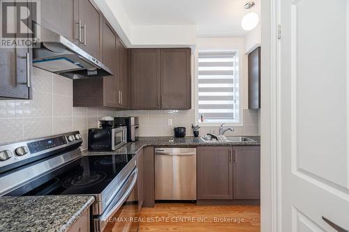 312 - 10 Halliford Place, Brampton (Goreway Drive Corridor), ON - Indoor Photo Showing Kitchen With Stainless Steel Kitchen