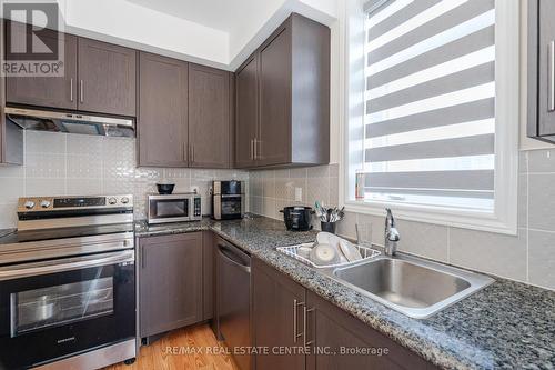 312 - 10 Halliford Place, Brampton (Goreway Drive Corridor), ON - Indoor Photo Showing Kitchen With Stainless Steel Kitchen With Double Sink