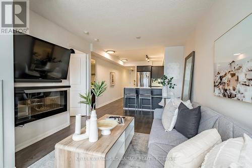 818 - 85 East Liberty Street, Toronto (Niagara), ON - Indoor Photo Showing Living Room With Fireplace