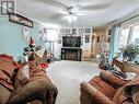 21 208 Eighth Street, 100 Mile House, BC  - Indoor Photo Showing Living Room With Fireplace 