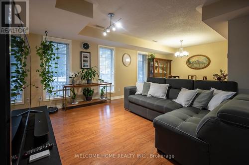 303 - 64 Sidney Belsey Crescent, Toronto (Weston), ON - Indoor Photo Showing Living Room