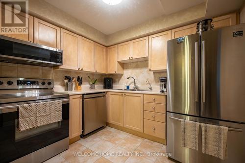 303 - 64 Sidney Belsey Crescent, Toronto (Weston), ON - Indoor Photo Showing Kitchen With Double Sink