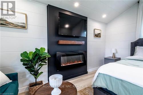 1368 Lorraine Road, Port Colborne, ON - Indoor Photo Showing Bedroom With Fireplace