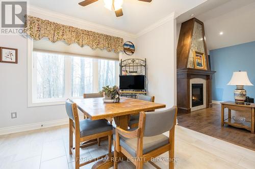 28 Timber Wolf Trail, Springwater (Minesing), ON - Indoor Photo Showing Dining Room With Fireplace