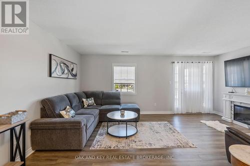 4 - 3320 Meadowgate Boulevard, London, ON - Indoor Photo Showing Living Room With Fireplace