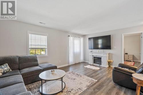 4 - 3320 Meadowgate Boulevard, London, ON - Indoor Photo Showing Living Room With Fireplace