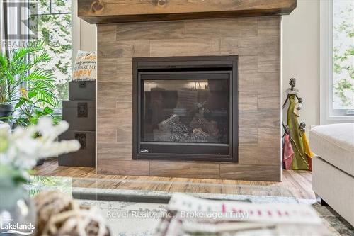 59 Trout Lane, Tiny, ON - Indoor Photo Showing Living Room With Fireplace