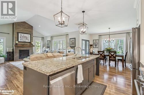 59 Trout Lane, Tiny, ON - Indoor Photo Showing Kitchen With Fireplace With Double Sink With Upgraded Kitchen