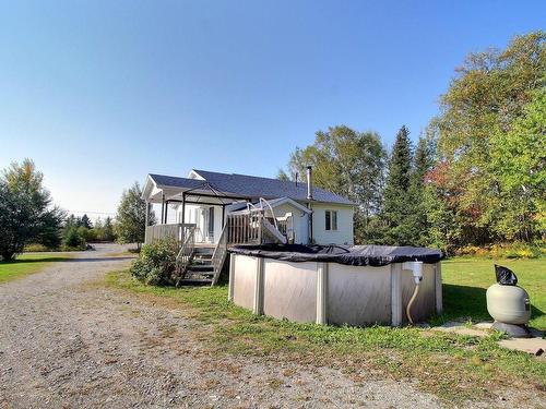 Back facade - 9 Rue Leclerc, Val-D'Or, QC - Outdoor With Above Ground Pool