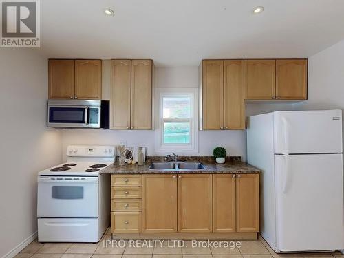 4 Mcmurchy Avenue S, Brampton (Downtown Brampton), ON - Indoor Photo Showing Kitchen With Double Sink