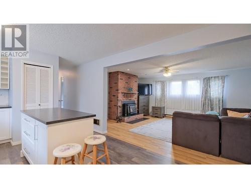 895 Theodora Road, Kelowna, BC - Indoor Photo Showing Other Room With Fireplace