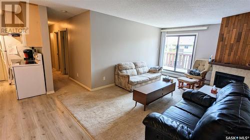 305E 1121 Mckercher Drive, Saskatoon, SK - Indoor Photo Showing Living Room With Fireplace