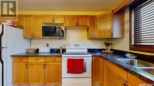7155 Bright Bay, Regina, SK - Indoor Photo Showing Kitchen With Double Sink