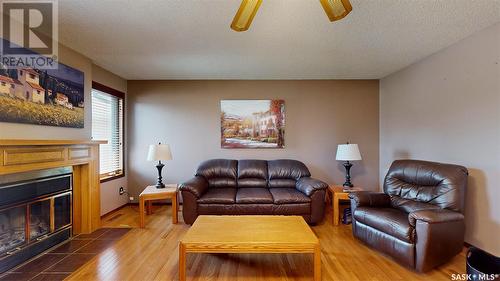 7155 Bright Bay, Regina, SK - Indoor Photo Showing Living Room With Fireplace