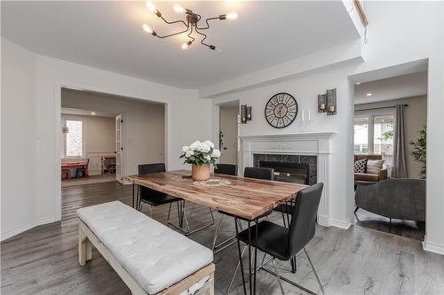 12 Strathroy Crescent, Waterdown, ON - Indoor Photo Showing Dining Room With Fireplace