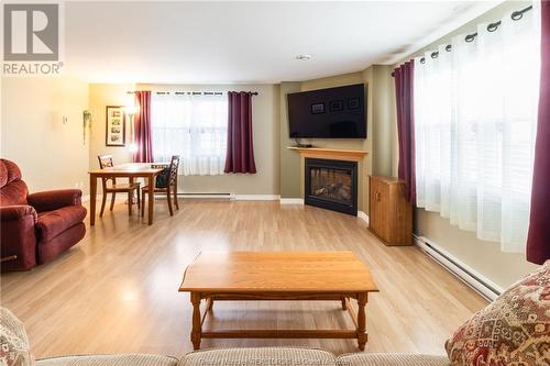 49 Fleuriant, Dieppe, NB - Indoor Photo Showing Living Room With Fireplace