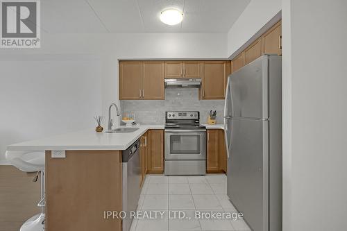 313 - 650 Sauve Street, Milton, ON - Indoor Photo Showing Kitchen With Stainless Steel Kitchen With Double Sink
