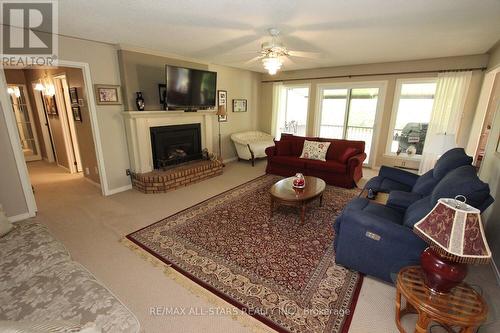 70 Balaclava Street, Kawartha Lakes, ON - Indoor Photo Showing Living Room With Fireplace