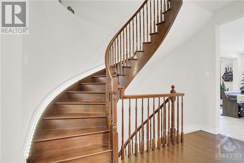 Beautiful spiral wood staircase - 915 Guinness Crescent, Ottawa, ON - Indoor Photo Showing Other Room