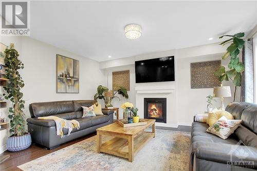 Huge Family room with gas fireplace - 915 Guinness Crescent, Ottawa, ON - Indoor Photo Showing Living Room With Fireplace