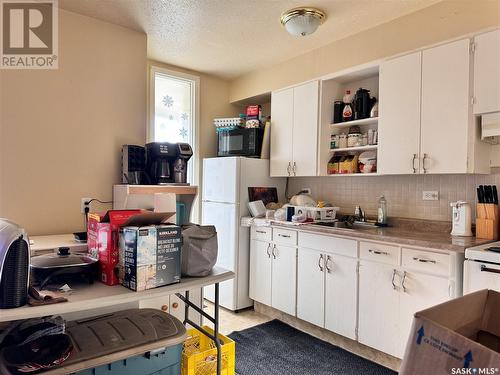 233 Moore Street, Foam Lake, SK - Indoor Photo Showing Kitchen With Double Sink