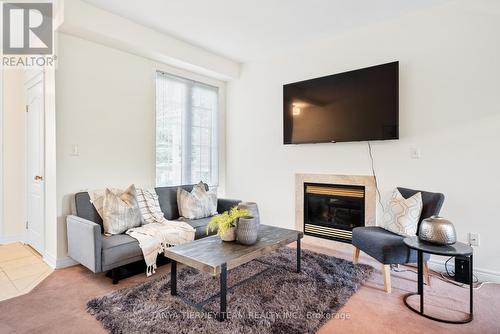 80 Pogonia Street, Toronto, ON - Indoor Photo Showing Living Room With Fireplace