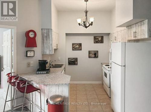 107 - 1730 Eglinton Avenue E, Toronto, ON - Indoor Photo Showing Kitchen With Double Sink