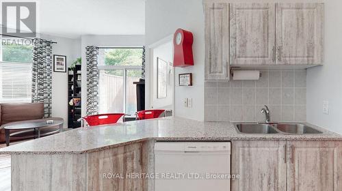 107 - 1730 Eglinton Avenue E, Toronto, ON - Indoor Photo Showing Kitchen With Double Sink