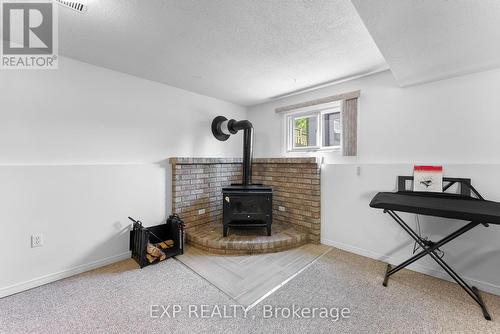 6840 Sunrise Court, Niagara Falls, ON - Indoor Photo Showing Other Room With Fireplace