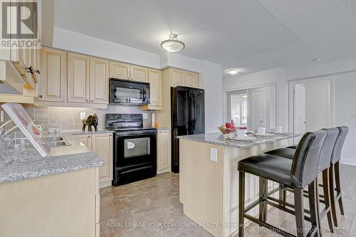 704 - 55 De Boers Drive, Toronto, ON - Indoor Photo Showing Kitchen With Double Sink