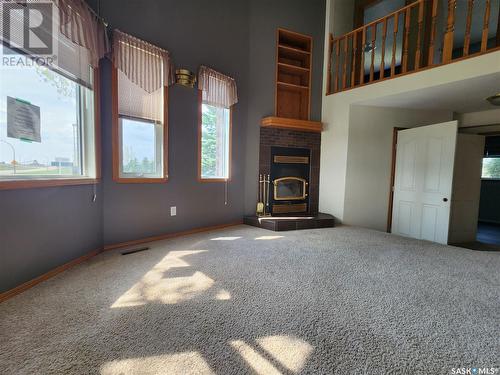 668 3Rd Avenue W, Melville, SK - Indoor Photo Showing Other Room With Fireplace
