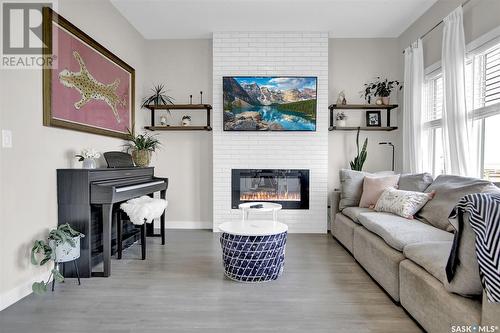 8020 Barley Crescent, Regina, SK - Indoor Photo Showing Living Room With Fireplace