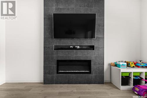 3534 Green Turtle Road, Regina, SK - Indoor Photo Showing Living Room With Fireplace