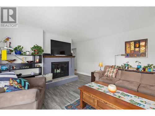 1290 Mary Court, Kelowna, BC - Indoor Photo Showing Living Room With Fireplace