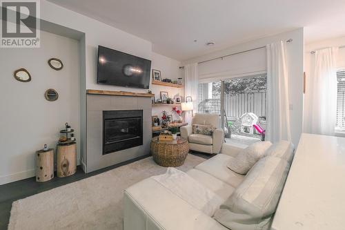 9563 Jensen Road Unit# 102, Lake Country, BC - Indoor Photo Showing Living Room With Fireplace