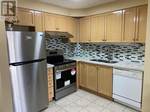 401 - 5235 Finch Avenue E, Toronto, ON - Indoor Photo Showing Kitchen With Double Sink